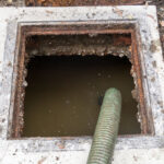 Draining an old septic tank that has been abandoned on a property